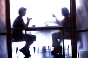 Image of two people having a conversation