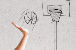 image of executive throwing basketball